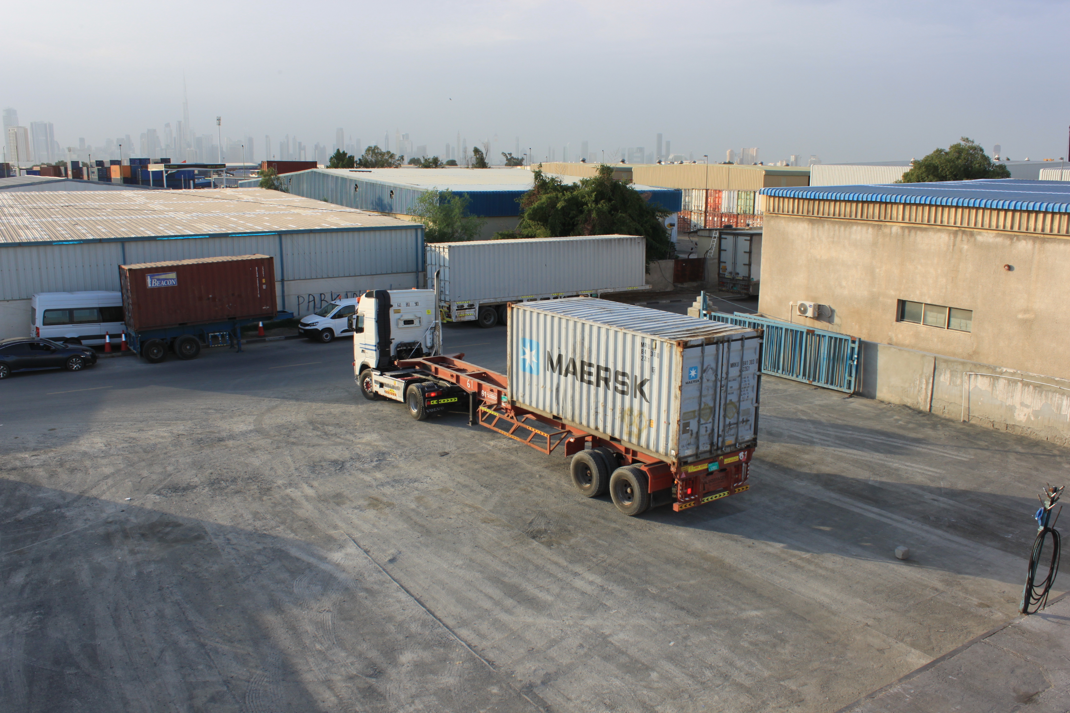 Photographs of spacious and well-organized warehouses used by Model Cargo Moovers ability to handle diverse shipping needs.Card image cap