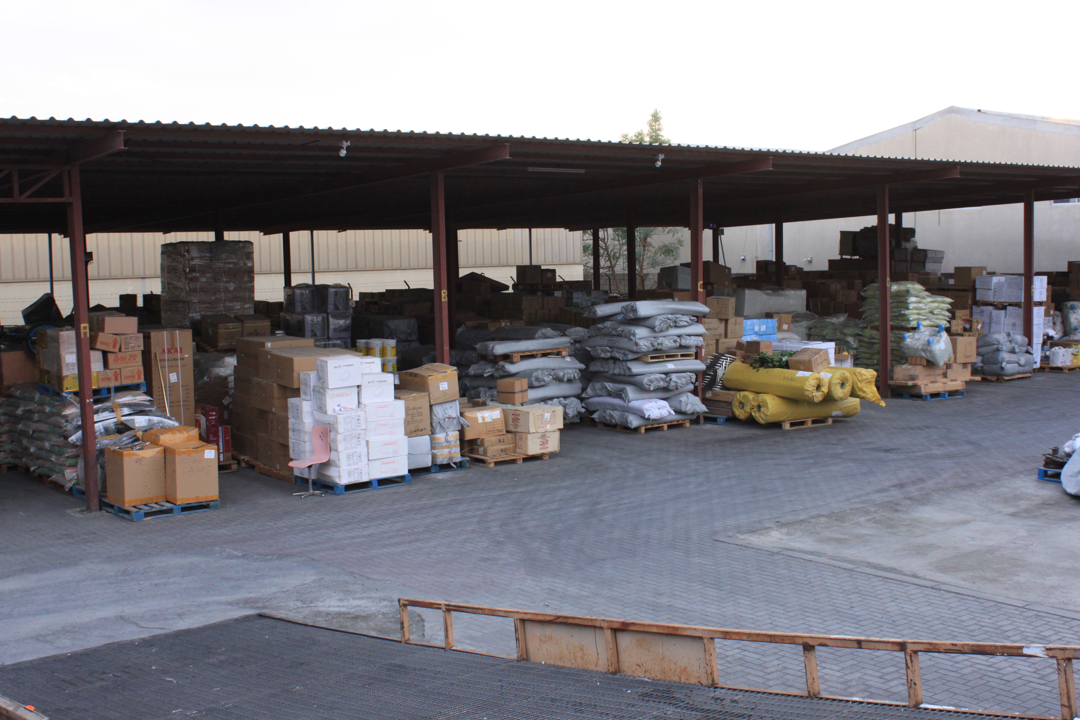 Photographs of spacious and well-organized warehouses used by Model Cargo Moovers to securely store and manage cargo